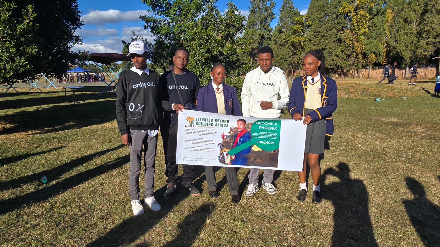 EBBA members with students at a school outreach event